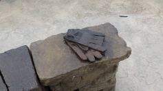 The bronzed gloves of one of the thousands of volunteers.